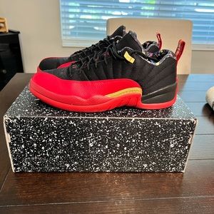 Jordan retro 12 lows. Black/Varsity Red/Gold